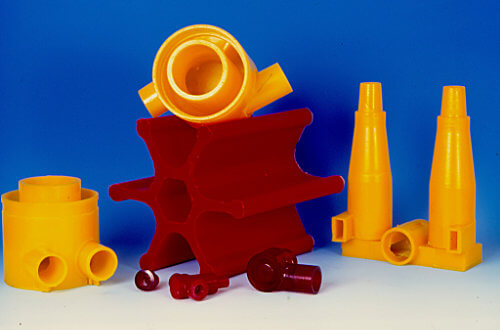 Various sizes and colors of polyurethane parts made using hydrocyclone process