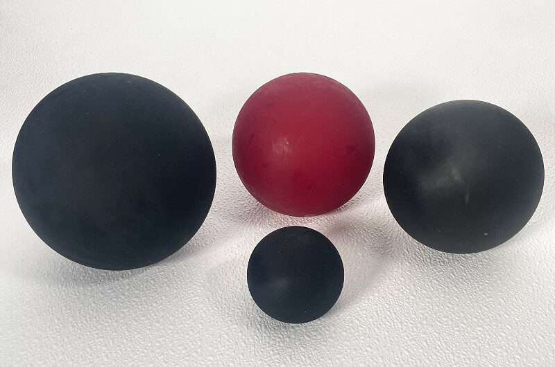 Black and red various sized industrial urethane balls