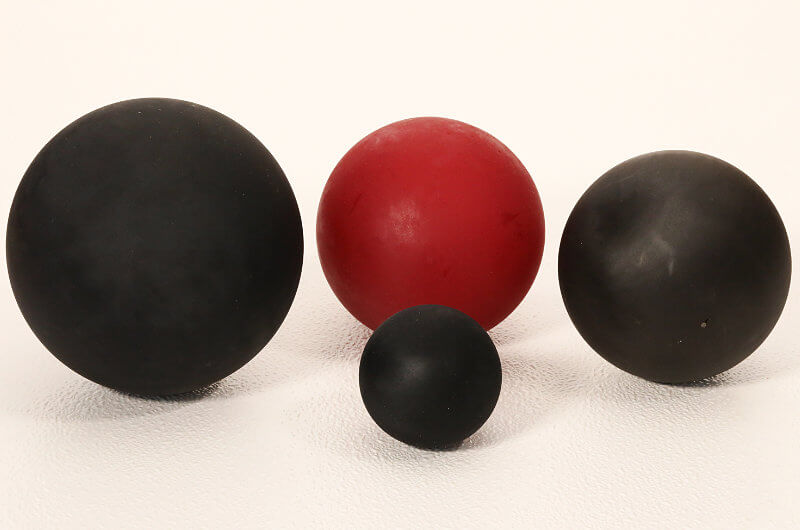 Red and black industrial urethane balls